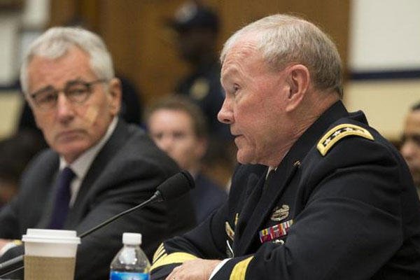 Joint Chiefs Chairman Gen. Martin Dempsey, right, accompanied by Defense Secretary Hagel, testifies on Capitol Hill in Washington, Thursday, Nov. 13, 2014, before the House Armed Services committee hearing on the ISIS. (AP Photo/Evan Vucci)