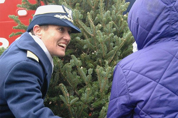 Capt. Amy Cocanour, commander of Coast Guard Sector Lake Michigan, helps present the ceremonial first Christmas tree during the Christmas Ship ceremony at Navy Pier, Dec. 6, 2014. (U.S. Coast Guard photo by Chief Petty Officer Alan Haraf)