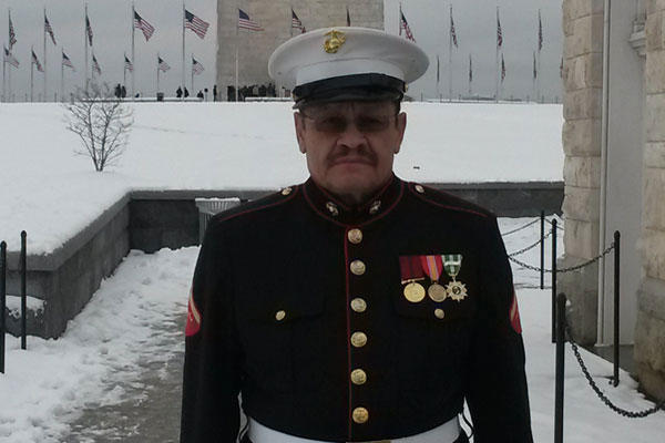 Vietnam veteran former Marine Manuel Valenzuela stands in the snow near the Washington Monument on Jan. 6. Valenzuela expected a large turnout but only a handful of supporters drove in from Chicago to go to the Capitol with him.