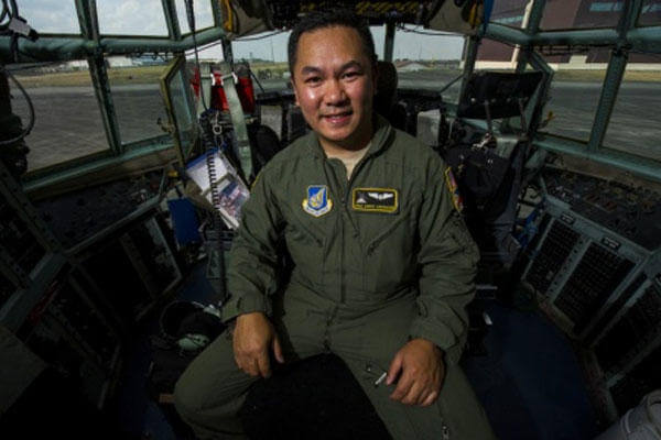 Air Force Staff Sgt. Andre Garrucho, a C-130 Hercules aircraft flight engineer with the 36th Airlift Squadron, Yokota Air Base sits in the flight deck of a C-130 at Clark Air Base, Philippines April 28, 2015. (U.S. Air Force photo/Staff Sgt. Nathan Allen)