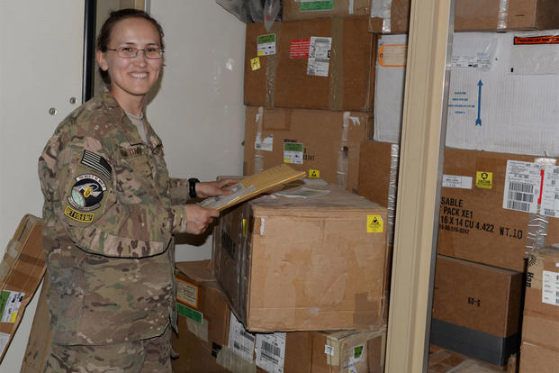  Air Force Senior Airman Aigerim Akhmetova, Expeditionary Air Mobility Squadron C-17 supply clerk, poses for a photo May 20, 2015, at Bagram Air Field, Afghanistan. (U.S. Air Force photo by Senior Airman Cierra Presentado)