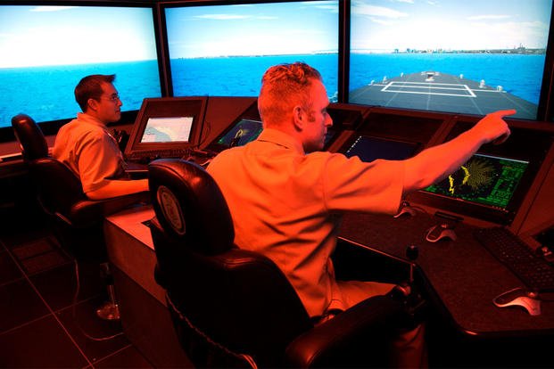 Surface Warfare Officer's School students navigate their virtual vessel through a number of simulated hazards in the school's full-mission bridge, May 16, 2007. (U.S. Navy photo/Mass Communication Specialist 2nd Class Jason McCammack)