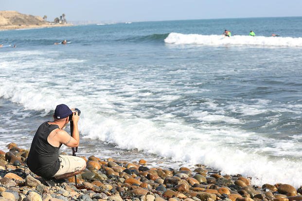 Marine Corps Staff Sgt. Matthew L. Slade photographs Operation Amped surfers on San Onofre Beach, Calif., Aug. 21, 2015. (U.S. Marine Corps photo by Cpl. Asia J. Sorenson)