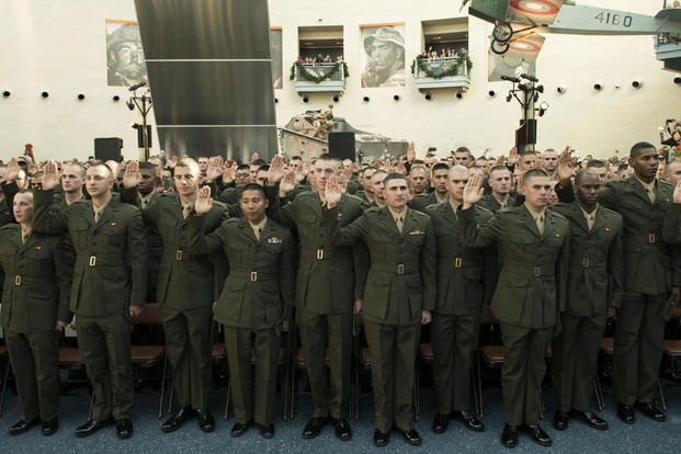 Candidates of Class OCC-220 in Officer Candidate School take their oaths of enlistment during their graduation ceremony at Marine Corps Base Quantico, Virginia. Nov. 24, 2015. (Photo: Lance Cpl. Erasmo Cortez III )