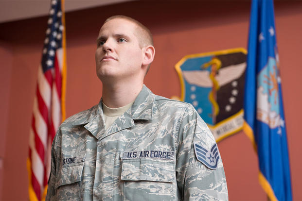 Staff Sgt. Spencer Stone, listens as the responsibilities of noncommissioned offers are read during a promotion ceremony at Travis Air Force Base, Calif., Oct. 30, 2015. (U.S. Air Force photo/Ken Wright)