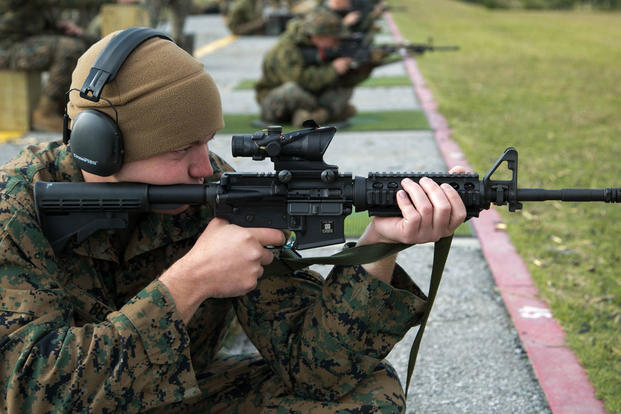 Cpl. James R. Beck, a Fixed-Wing Aircraft Power Plants Mechanic from Marine Corps Air Station Iwakuni, fires on his target during the Far East Division Marksmanship Match Dec. 17 aboard Camp Hansen, Okinawa, Japan. (Photo: Lance Cpl. Doug Simons)