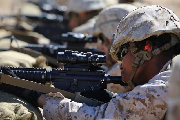 Lance Cpl. Falande Joachin fires the M4 Modular Weapon System during a zeroing exercise at Range 106, Marine Corps Air Ground Combat Center Twentynine Palms, California, Feb. 24, 2015. (U.S. Marine Corps/Sgt. Alicia R. Leaders)