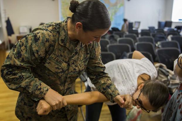 Women with a U.S. Marine Female Engagement Team operating in Europe interact with high school students at the National Library of Romania in Bucharest, 26 Sept., 2016. (U.S. Marine Corps/Sgt. Michelle Reif)