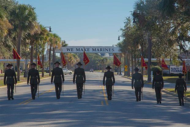 Drill instructors at Parris Island retire the guidons Dec. 2, 2016. (Marine Corps Photo)