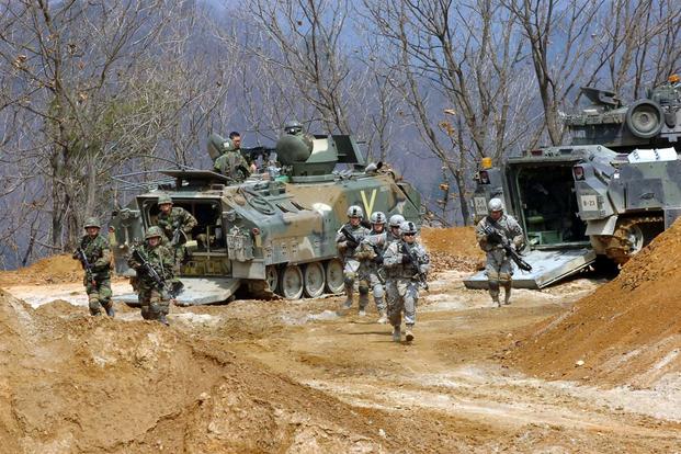 FILE -- Soldiers from the 2nd Infantry Division and the Republic of Korea army participate in a combined live-fire event on Rodriquez Multi-purpose Live-fire Range Complex in Pocheon, South Korea, in 2011. (U.S. Army/Yu Huson)