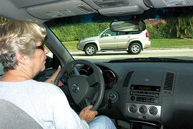 Elderly driver, dashboard view.