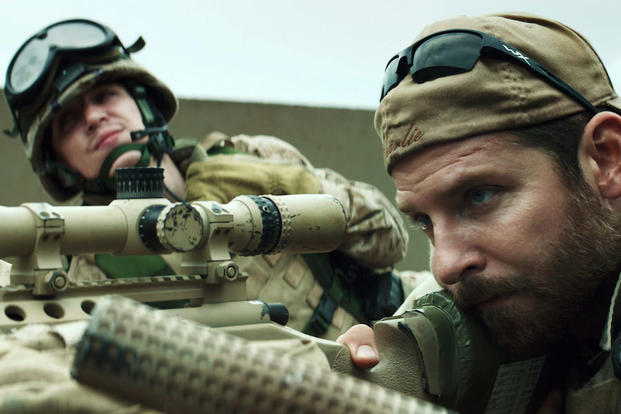 In this image released by Warner Bros. Pictures, Kyle Gallner, left, and Bradley Cooper appear in a scene from &quot;American Sniper.&quot; 