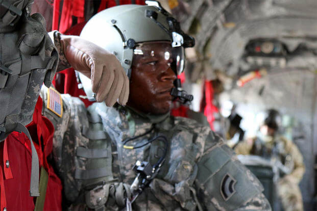 Maryland National Guard's Sgt. DaShaun Hood, a CH-47 "Chinook" crew chief, monitors in-flight operations during a route familiarization exercise at the Fort Polk, Louisiana, July 13, 2016. (U.S. Army/Sgt. Michael Davis)