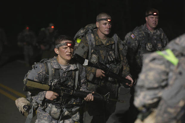 U.S. Army Soldiers conduct a 12-mile foot march during the Ranger Course on Fort Benning, GA., April 23, 2015. Soldiers attend the Ranger Course to learn additional skills in a physically demanding environment. (U.S. Army /Sgt. Paul Sale/Released)