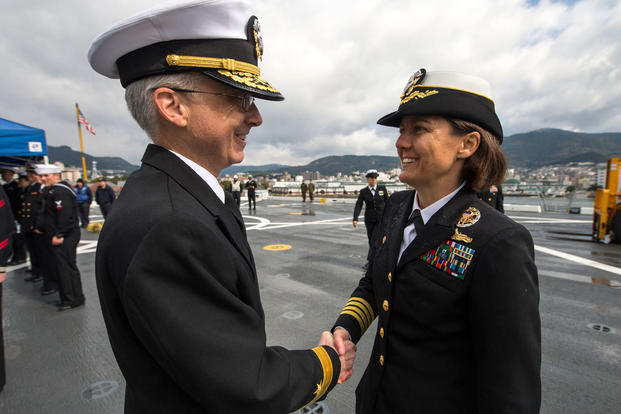 Capt. Kristy McCallum greets Rear Adm. Hugh Wetherald
