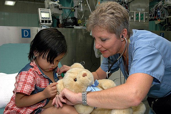 Project Hope nurse Diane Speranza listens to a child's heartbeat while taking her vital signs aboard the U.S. Military Sealift Command (MSC) Hospital ship USNS Mercy (T-AH 19). (U.S. Navy/Photographer's Mate 2nd Class Erika N. Jones)