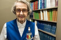 Helen Wells, a 94-year-old assistant library volunteer for the 59th Medical Wing, poses for a photo. (U.S. Air Force/Kevin Iinuma)