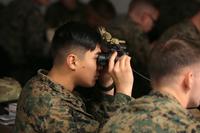 A Marine peers through the lens of the Squad Binocular Night Vision Goggles during new equipment training in December 2018 at Camp Lejeune, North Carolina. The Marine Corps awarded a contract Sept. 6, 2019, to procure approximately 14,000 systems. (Photo: Marine Corps)