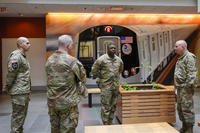 Members of the Armed Forces including the National Guard wait in the lobby of the New York City Mass Transit Authority Rail Control Center