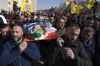 Mourners carry the body of Omar Assad during his funeral in the West Bank.