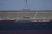 A crane loads food aid for Gaza at Larnaca port, Cyprus