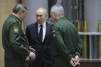 Russian President Vladimir Putin talks with Russian Chief of General Staff Gen. Valery Gerasimov