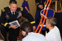 Army Chief of Staff Gen. Daniel Allyn talks with a military child at the 17th Military Child Education Coalition put on by the Military Child Education Coalition and held in Washington, D.C., July 27-28, 2015.(U.S. Army photo/ J.D. Leipold)