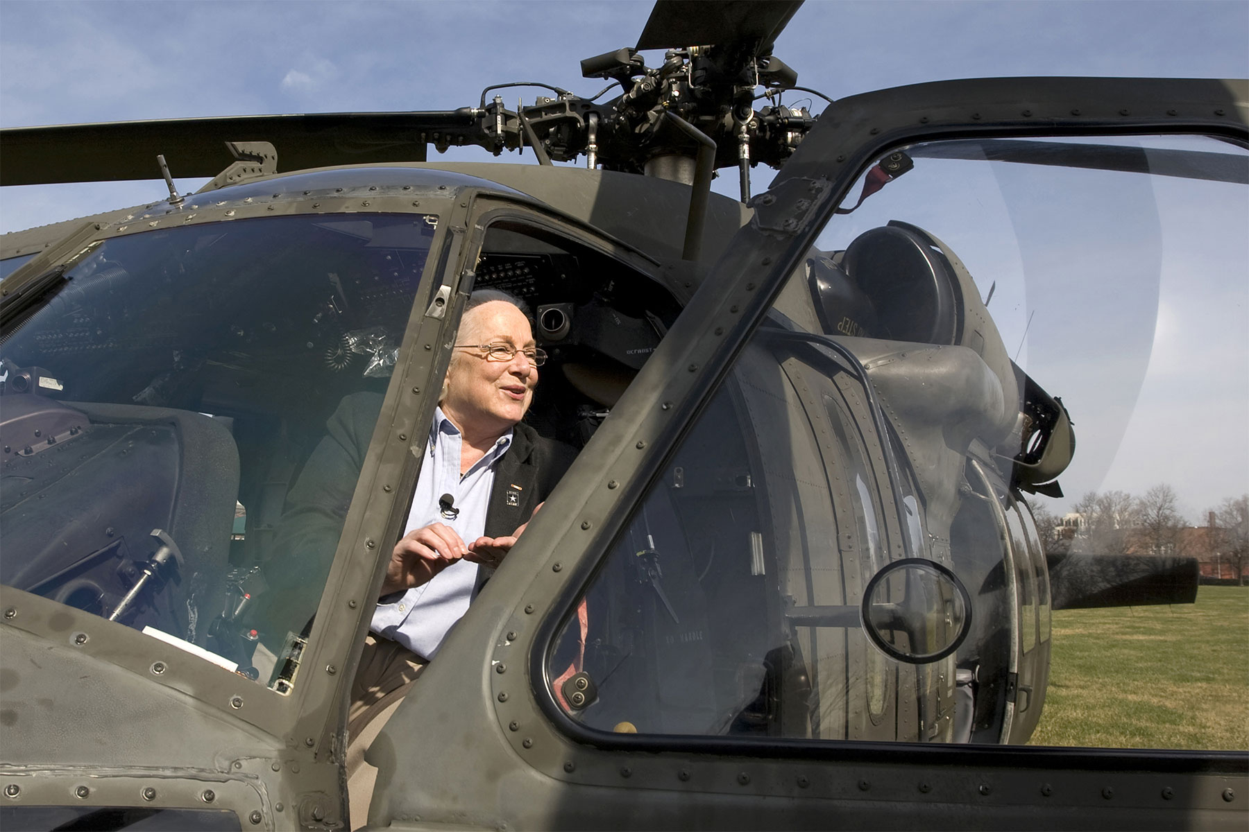 Retired Col. Sally Murphy checks out a Black Hawk helicopter at Fort Myer during a Freedom Team Salute program honoring her as the first woman to complete Army flight school at Fort Rucker in 1974 and became the Army's first female helicopter pilot. (U.S. Army)