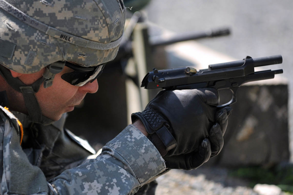<em>The safety actuates in the opposite direction of most pistol safeties because it is also a decocker (U.S. Army)</em>