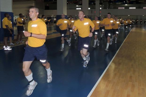 Recruits run during a physical fitness assessment in the Freedom Hall Physical Fitness Facility at Recruit Training Command, Great Lakes, Illinois. (U.S. Navy/Scott A. Thornbloom)