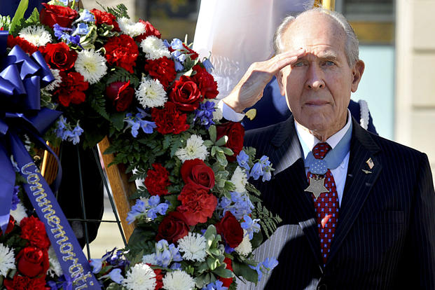 Medal of Honor recipient retired Capt. Thomas Hudner salutes while taps is played during the Centennial of Naval Aviation wreath laying ceremony held at the United States Navy Memorial in Washington, D.C., Dec. 1, 2011. (U.S. Navy photo/Mikelle D. Smith)