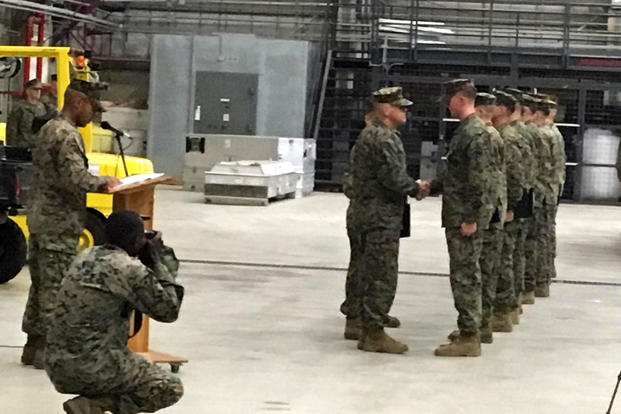 Marines receive medals from the Commandant of the Marine Corps at Naval Air Station Sigonella, Italy for supporting an investigation into the deaths of Green Berets in Niger. (Hope Hodge Seck/Military.com)