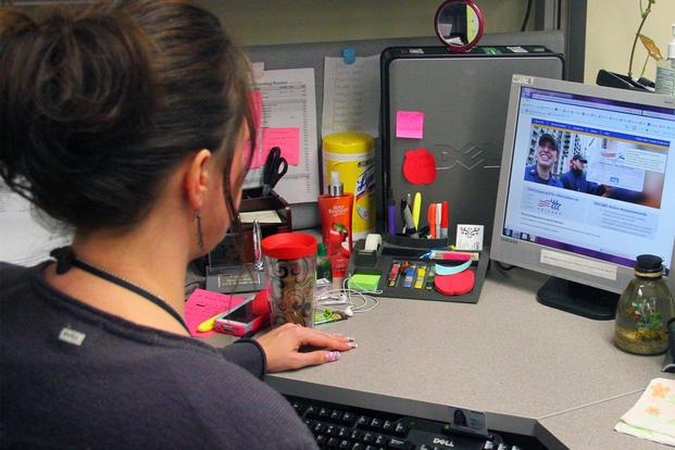 A military family member uses TRICARE online. (U.S Army/SPC Paxton Busch)