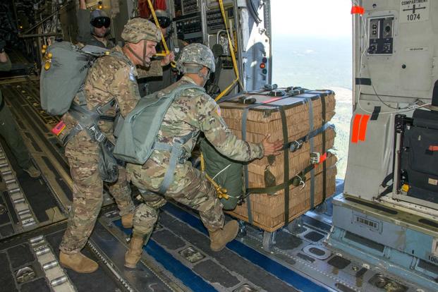 Paratroopers from the 82nd Airborne Division position the Caster Assisted A-Series Delivery System in the door of a U.S. Air Force C-17 aircraft before deployment onto Sicily Drop Zone on Fort Bragg, North Carolina. Photo: (U.S. Army)
