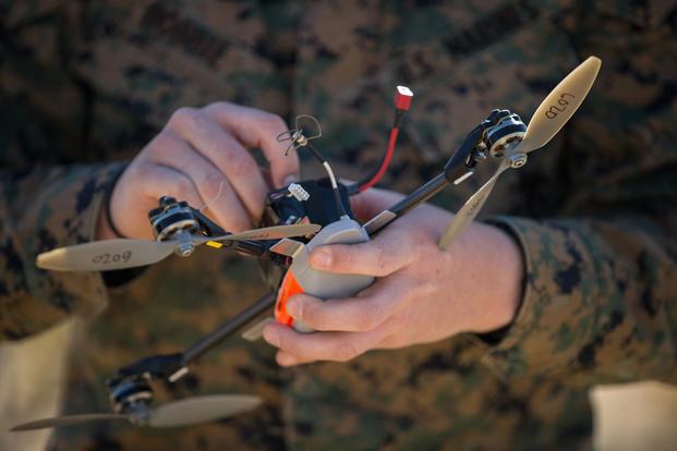 U.S. Marine Corps Lance Cpl. David Bobbie replaces the battery for an InstanEye quadcopter during a Quads for Squads training event on Marine Corps Air Ground Combat Center Twentynine Palms, Calif., Feb. 28, 2018. (U.S. Marine Corps/Cpl. Miguel A. Rosales)