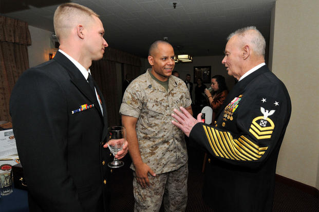 Chief Explosive Ordnance Disposal Technician Daniel Martin, from Houston, and Gunnery Sgt. Tony Smith, from Columbus, Ohio, chat with Master Chief Boatswain's Mate (SEAL) (Ret.) Rudy Boesch during a Chief Petty Officer (CPO) Dining Out event at Commander Fleet Activities Yokosuka. (Photo: U.S. Navy)