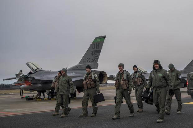 F-16 pilots from the 180th Fighter Wing, Ohio Air National Guard, walk toward the terminal at Amari Air Base, Estonia, Jan. 14, 2018. (DoD photo by MC3 Cody Hendrix)