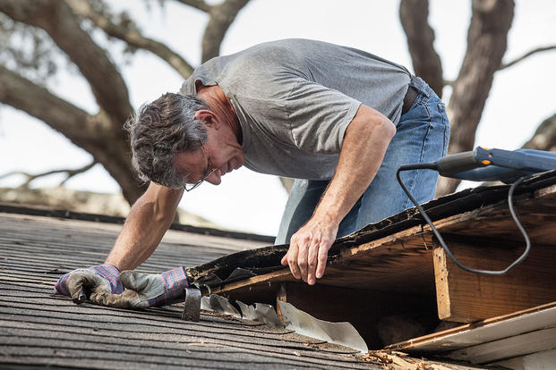 Man fixing a roof