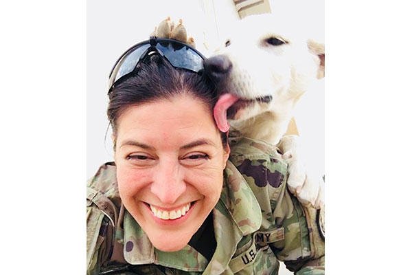 Erby the dog lays a kiss on Sgt. Tracy McKithern in the Kurdistan Training Coordination Center (KTCC), near Erbil, Iraq, Nov. 7, 2017. (U.S. Army photo by Sgt. Tracy McKithern)