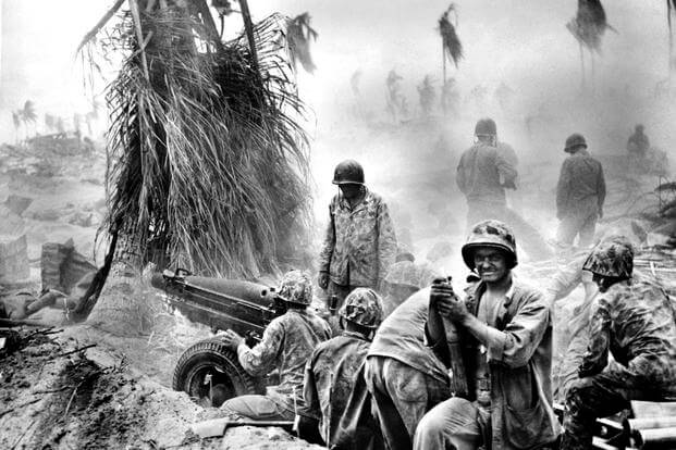November 1943: U.S. Marines at the Battle of Tarawa in the Gilbert islands. Two Marines killed in that battle, which claimed the lives of 1,696 U.S. service members, were laid to rest on May 5. (US Marine Corps photo)