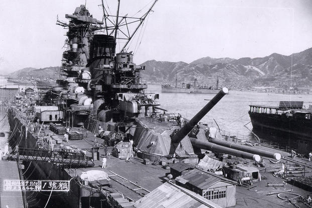 Japanese battleship Yamato under construction at the Kure Naval Base, Japan, September 20, 1941. The aircraft carrier Hōshō is at the extreme right. The supply ship Mamiya is in the center distance. Navy photo