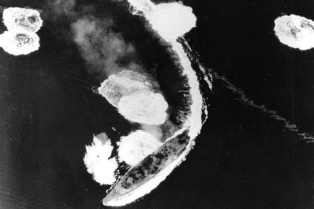 Japanese battleship Yamato maneuvers while under heavy air attack by U.S. Navy Task Force 58 planes in the Inland Sea off Kure on March 19, 1945. She was not seriously damaged in these attacks. Photographed from a USS Hornet (CV-12) plane. Navy photo