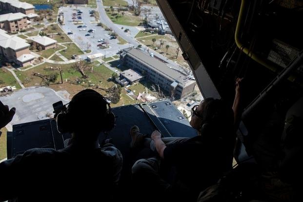 John W. Henderson, left, the Assistant Secretary of the Air Force for Installations, Environment and Energy, and Secretary of the Air Force Heather Wilson, right, look at the aftermath left from Hurricane Michael from a CV-22 Osprey tiltrotor aircraft assigned to the 8th Special Operations Squadron above northwest Florida, Oct. 14, 2018.  (Joseph Pick/U.S. Air Force)