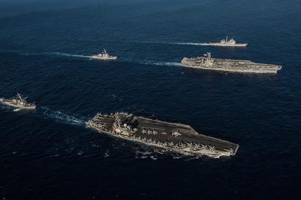 Ships with the Ronald Reagan Carrier Strike Group and John C. Stennis Carrier Strike Group transit the Philippine Sea during dual carrier operations. (U.S. Navy/Mass Communication Specialist 2nd Class Kaila V. Peters)