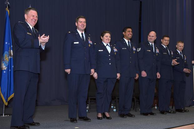 U.S. Air Force Lt. Gen. Brad Webb, left, commander of Air Force Special Operations Command, congratulates six Air Commandos during a Distinguished Flying Cross ceremony at Hurlburt Field, Florida, Jan. 22, 2019. (U.S. Air Force/Tech. Sgt. Kentavist P. Brackin)