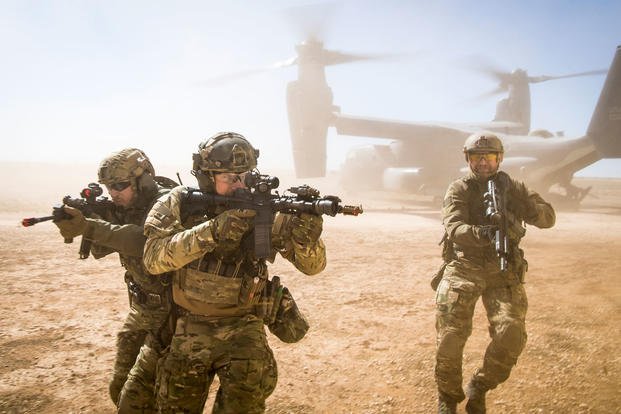 A joint special forces team move together out of a U.S. Air Force CV-22 Osprey Feb. 26, 2018, at Melrose Training Range, New Mexico. (U.S. Air Force photo/Clayton Cupit)