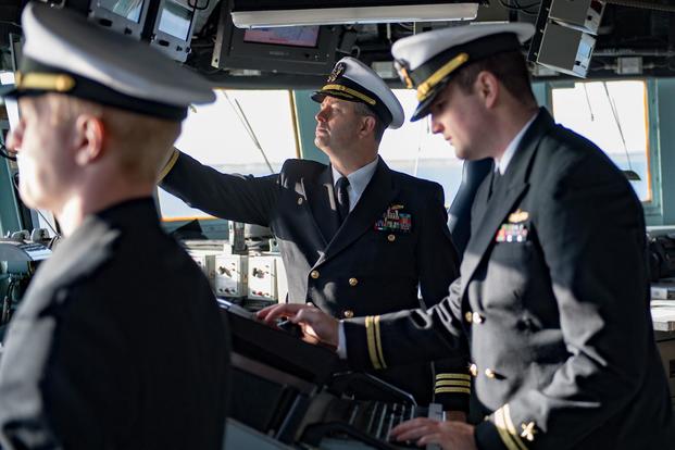 Cmdr. Thomas Van Scoten, commanding officer of the Arleigh Burke-Class guided-missile destroyer USS Winston S. Churchill (DDG 81), monitors ship systems from the bridge as the ship gets underway. (U.S. Navy/Mass Communication Specialist 3rd Class Evan Thompson)