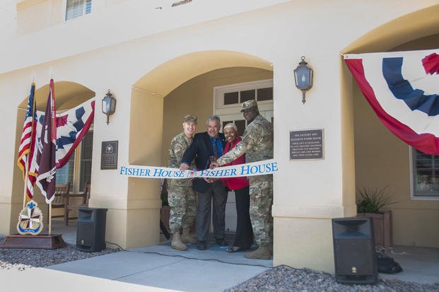 Col. John A. Smyrski III, commander, William Beaumont Army Medical Center, John Ost III, di-rector, Army Fisher House Program, Alice Coleman, manager, WBAMC Fisher House, and Command Sgt. Maj. Donald George, command sergeant major, WBAMC, cut the ribbon to the newly renovated Fisher House on the WBAMC campus, May 12, 2017. (Marcy Sanchez/U.S. Army)