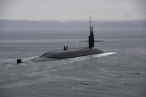 The Ohio-class ballistic-missile submarine USS Kentucky (SSBN 737) departs Naval Base Kitsap-Bangor for the boat's first strategic deterrent patrol since 2011. (U.S. Navy/Mass Communication Specialist 2nd Class Amanda R. Gray)