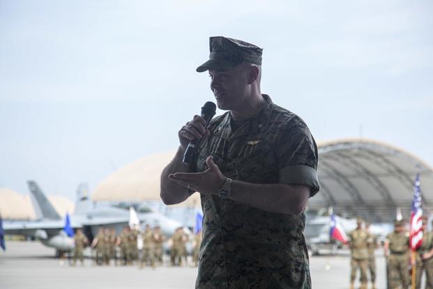 U.S. Marine Corps Lt. Col. James R. Compton, commanding officer of Marine All-Weather Fighter Attack Squadron (VMFA (AW)) 242, addresses guests during a change of command ceremony at Marine Corps Air Station Iwakuni, Japan, May 25, 2018. (U.S. Marine Corps/Sgt. James A. Guillory)